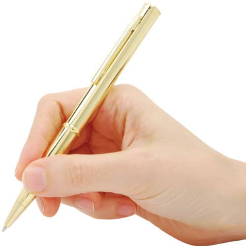 Gold pen knife in hand writing