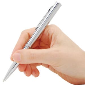 Silver pen knife in hand writing