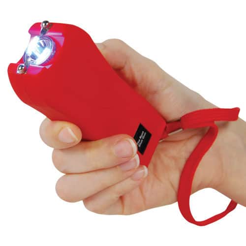 Red runt stun gun in hand being fired