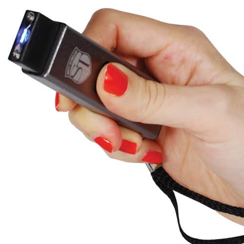 Silver slider stun gun being fired by a woman