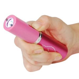 pink lipstick stun gun in womans hand