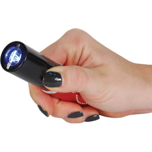 red lipstick stun gun in womans hand