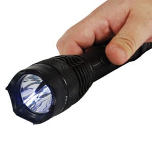 Stun flashlight baton in hand