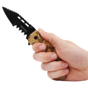Camouflage folding knife open in hand