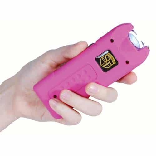 pink multiguard stun gun in womans hand
