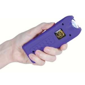 purple multiguard stun gun in womans hand
