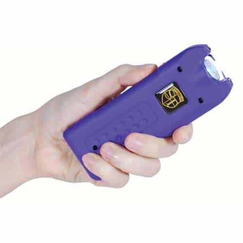 purple multiguard stun gun in womans hand