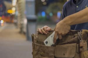 woman putting taser bolt 2 into her purse